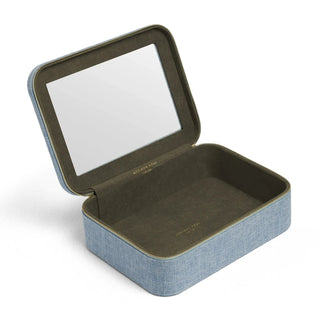 A rectangular jewelry box with a hinged lid, featuring a light blue linen-textured exterior, a dark olive green velvet interior, and a clear mirror on the inside of the lid.