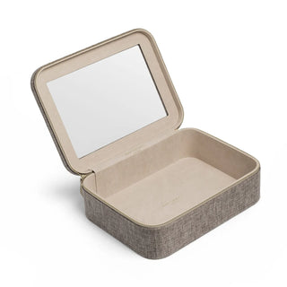 An open rectangular jewelry box with a hinged lid featuring an integrated mirror, upholstered in a textured taupe fabric with a beige interior, shown on a clean white background.