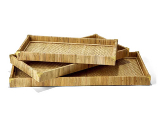 A stack of three rattan trays with brass end corners. Comes in small, medium and large.