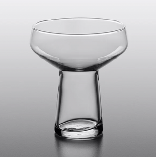 A clear, elegant Margarita coupe glass with a wide top and a narrow stemless base.