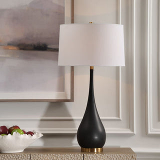 Black teardrop-shaped table lamp with a white shade