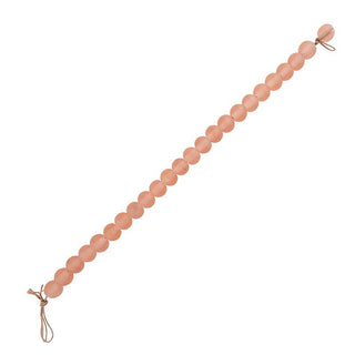 Peach-colored beaded garland on a white background