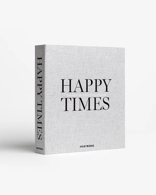 A hardcover art book titled 'HAPPY TIMES' by PRINTWEEKS, featuring a light gray linen-textured cover and spine, displayed on a clean white background.