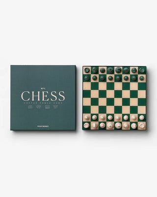Chess set with green and white pieces and a green box on a white background