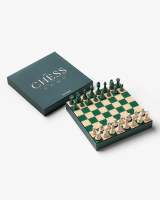 Chess set with pieces and board on a white background