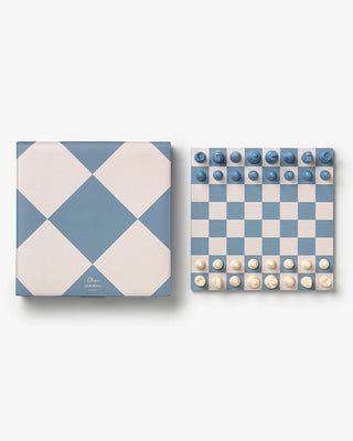Checkered board with blue and white pieces on a white background