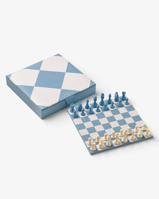 Blue and white checkered chess set with pieces on a white background
