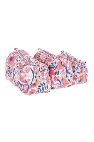 Pair of floral-patterned slippers on a white background