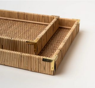 This medium rattan tray is built sturdy with brass endcaps and a solid wood bottom