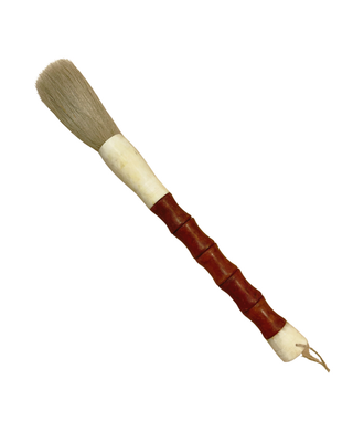 A traditional Chinese calligraphy brush with a reddish-brown bamboo-look handle, a cream-colored ferrule, and light brown bristles, shown on a plain white background.