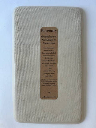 A square beige fabric-covered plaque with rounded corners and a central brown paper label that reads 'Rosemary' and includes a memorial remembrance message.