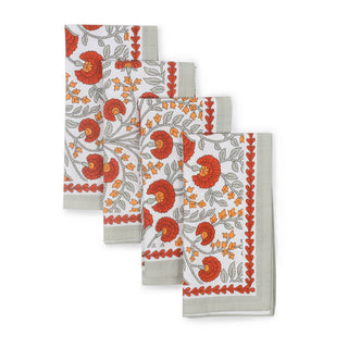 Set of four floral patterned towels on a white background