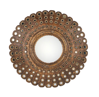 An ornate round wall mirror with a wide, decorative frame featuring intricate floral cutout patterns in gold, bronze, and black.