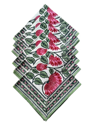 Set of pink floral patterned napkins on a white background