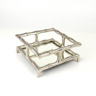 A silver bamboo cocktail napkin tray with a geometric pattern, crafted from aluminum with a bamboo-inspired design.