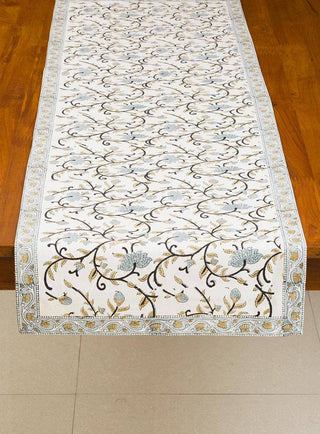 Decorative blue block print table runner with floral patterns and border