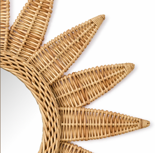 Detail of woven rattan on sunburst wall irror