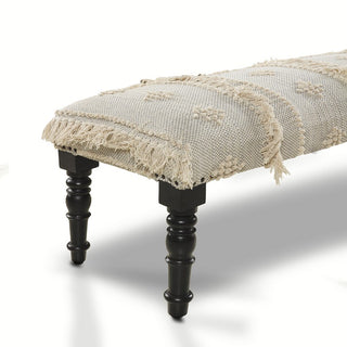 Decorative bench with lace top and black legs on a white background