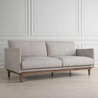 Mid-century styled sofa with wooden legs