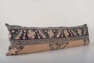 One-of-a-kind vintage rug pillow made for long couch or bed