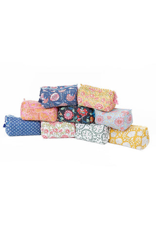 Collection of colorful fabric swatches stacked on a white background