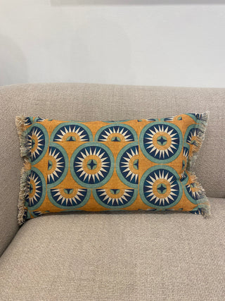 Decorative pillow with geometric pattern on a beige couch