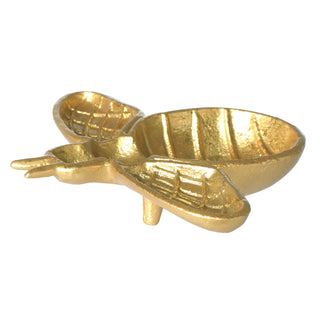 Gold-colored lobster-shaped object on a white background