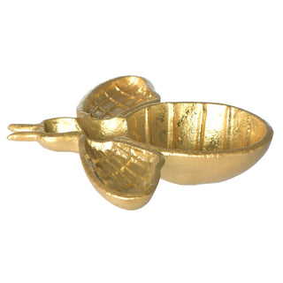 Gold-colored heart-shaped object on a white background