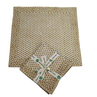 Set of four Mustard Blossom hand block print cotton napkins with a mustard yellow floral pattern and decorative border
